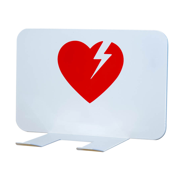 Ett väggfäste till hjärtstartare. Fästet är vitt med en röd hjärtstartarsymbol på. 
