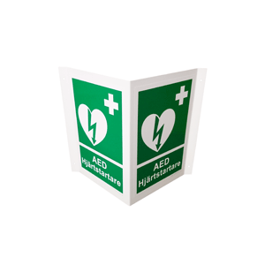 Grön vinkelskylt för hjärtstartare. Skylten innehar hjärtstartarsymbolen i vitt med texten "AED hjärtstartare" under. 